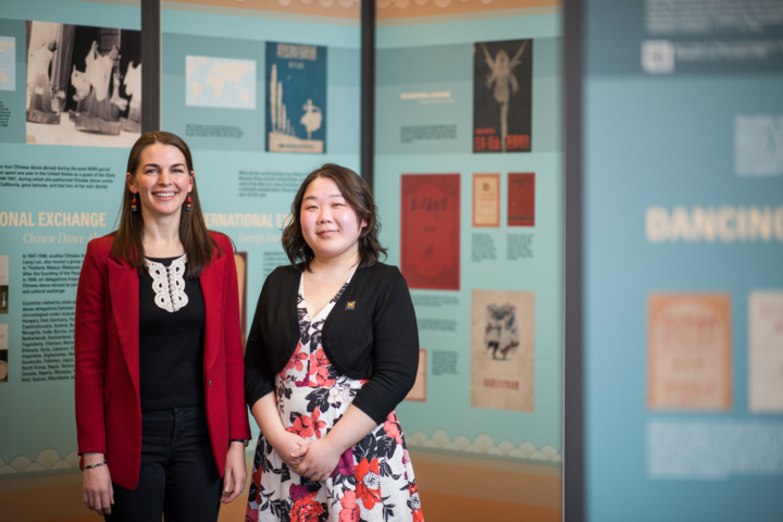 Emily Wilcox and Liangyu Fu in front of exhibit