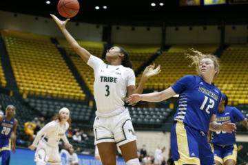 Kayla Beckwith goes for a layup in a basketball game