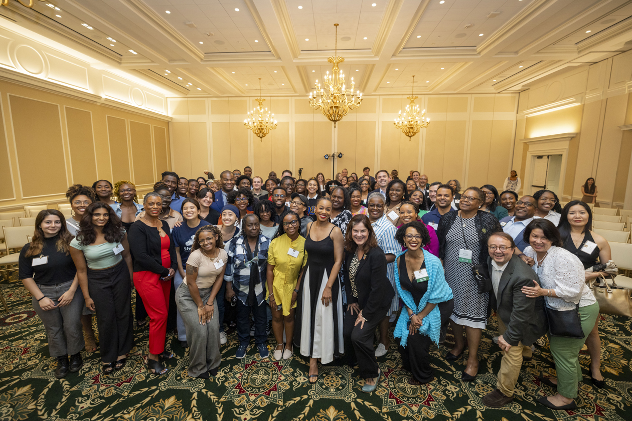 A large group of people pose for a photo together.