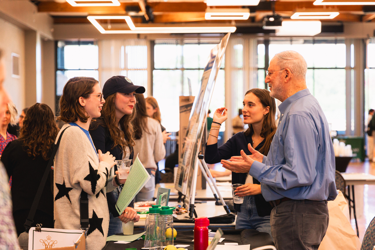 Students and faculty discuss research opportunities at a fair to highlight all the interesting topics under study on campus