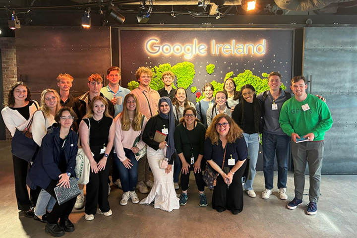 People gather for a photo by a sign that says Google Ireland.