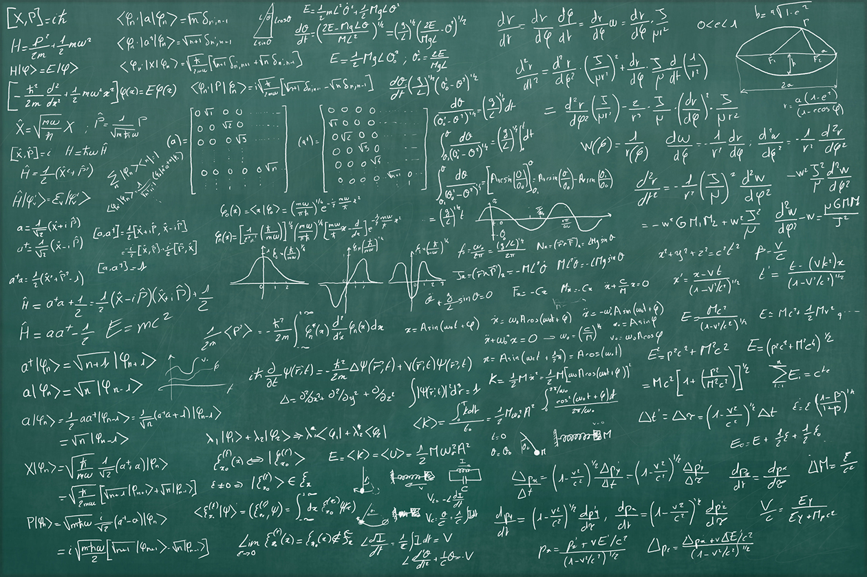 Photo of a blackboard with physics equations