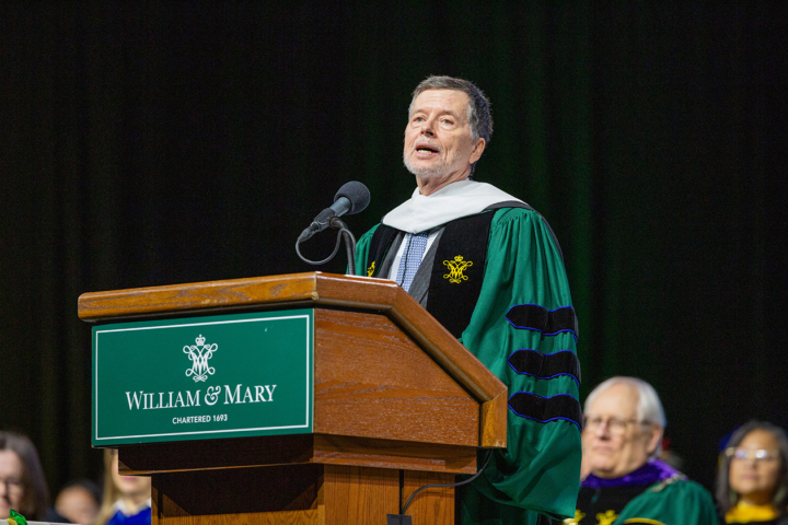 Ken Burns speaks while standing at a podium.