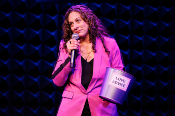This is a photo of comedienne Jenny Hagel '98, who is appearing at the 2026 Ampersand Festival
