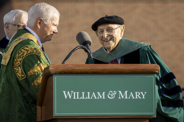Frank Shatz approaches a podium with a William & Mary sign on it.