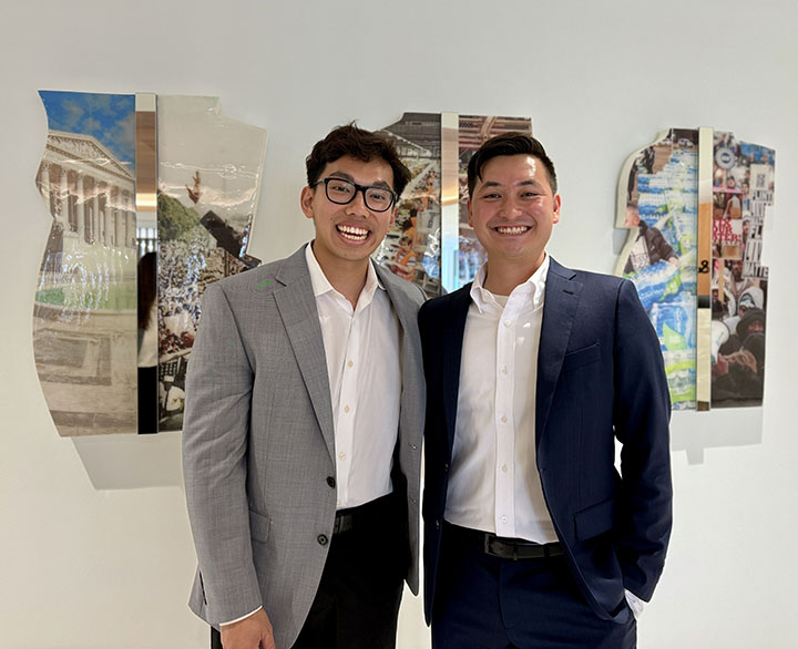Two people pose for a photo together.