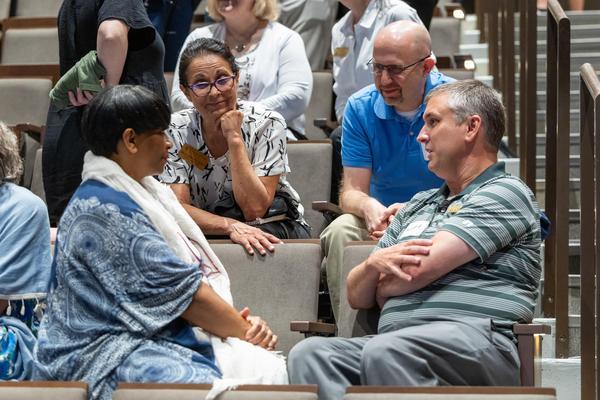 William & Mary employees talk during part of the university's Professional Development Days program