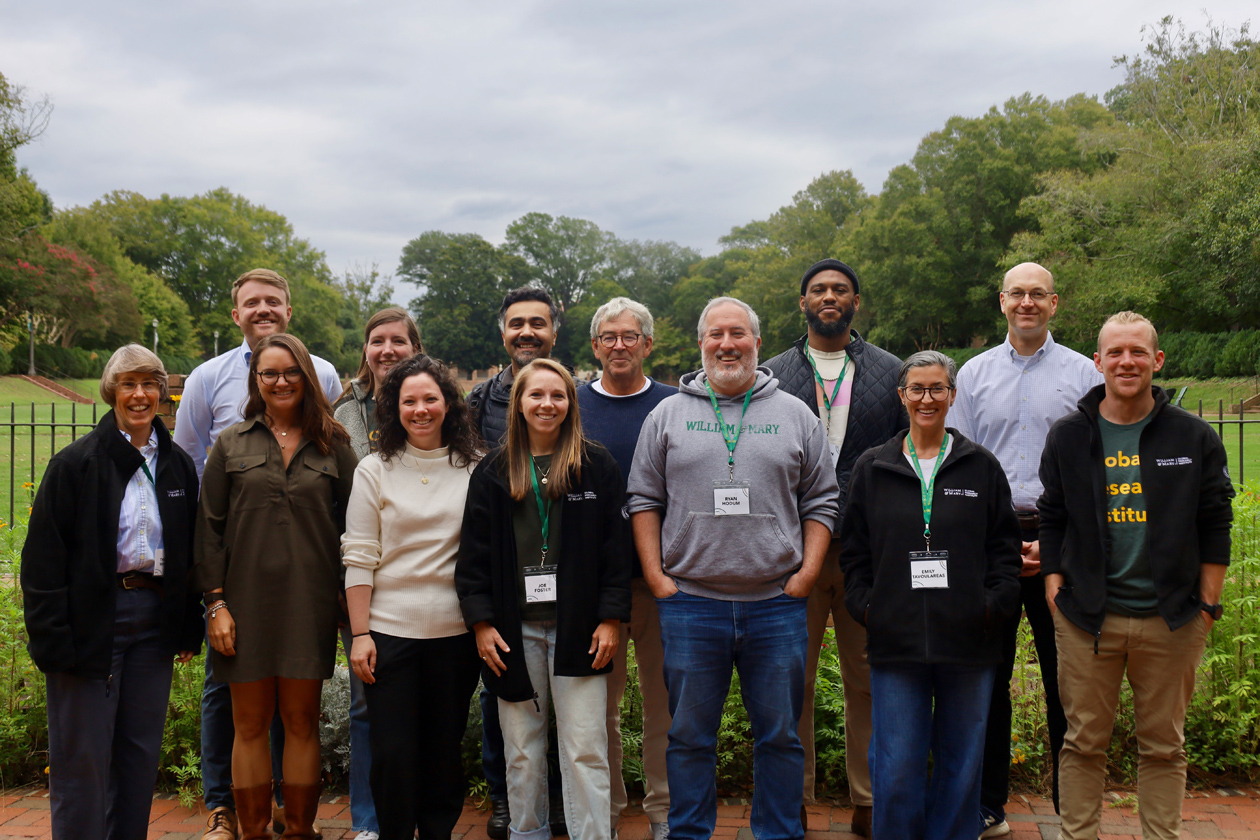 A group of people take a photo together in an outdoor location.