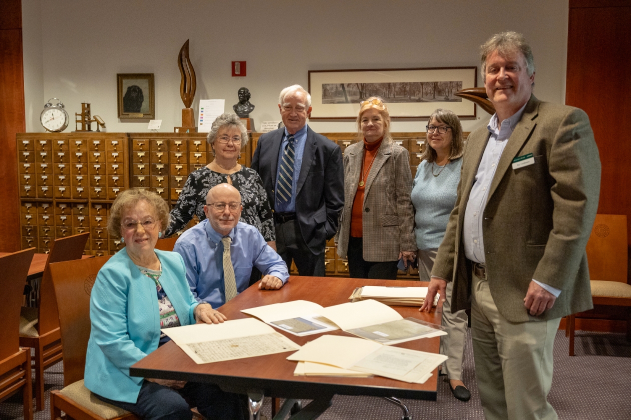 This is a photo of the Martin family who have donated their patriarch's collection of American Revolution-era artifacts to W&M libraries.