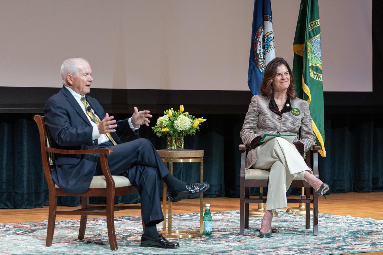 This is a photo of W&M Chancellor Robert M. Gates and President Katherine A. Rowe in conversation during Homecoming Weekend 2026