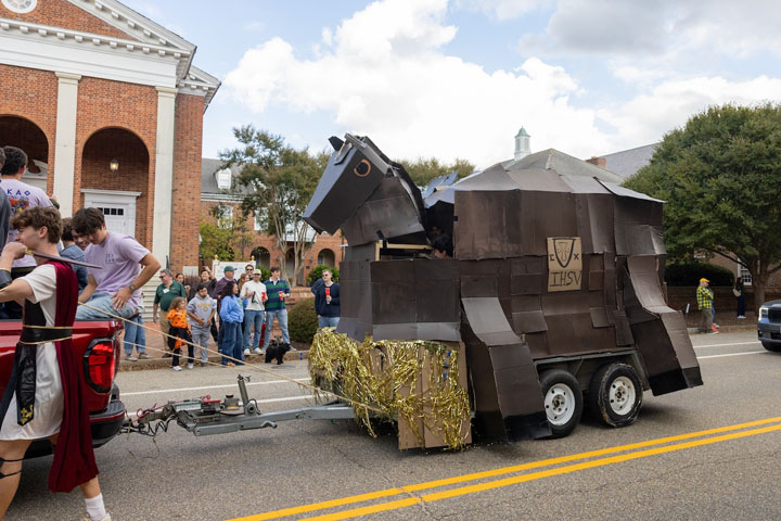A parade float includes a large horse.